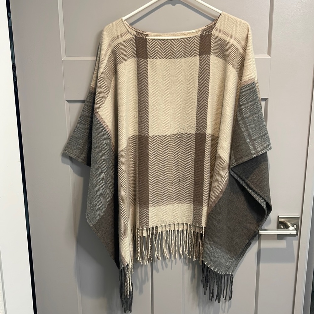 Sweater poncho with fringe